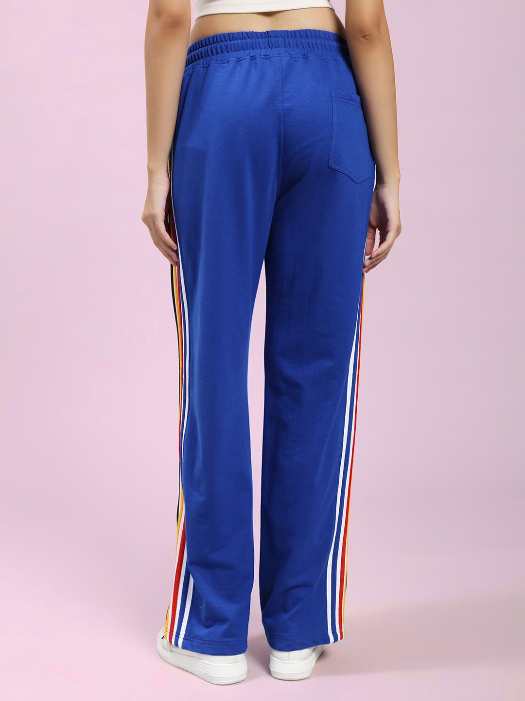 Back view of WOMEN'S MODERN EDGE MULTI-STRIPE JOGGER ROYAL BLUE showcasing vibrant stripes and comfortable fit.