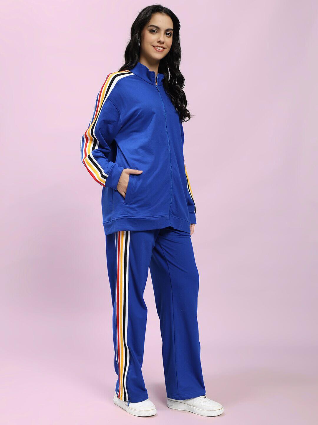 Model wearing WOMEN MODERN EDGE MULTI-STRIPE CO-ORD SET ROYAL BLUE with sporty stripe accents, showcasing comfortable and stylish streetwear.