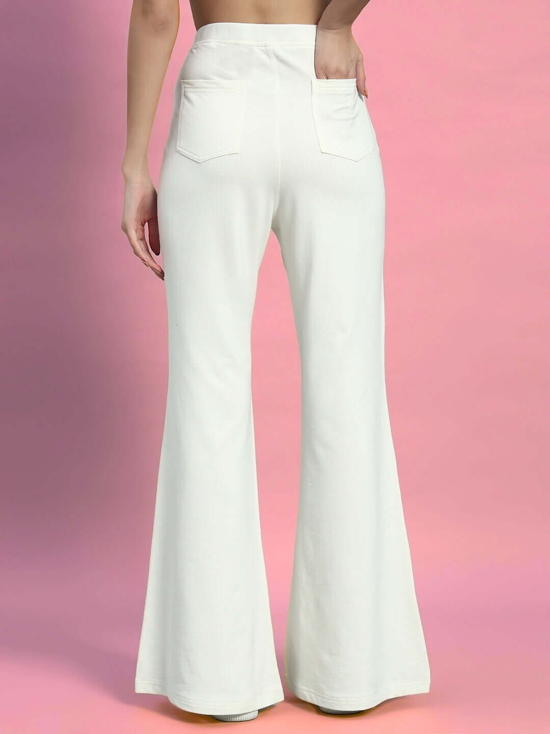 Model wearing women's off-white moon night co-ord set featuring flared legs and a relaxed fit with an elastic waistband, back view.