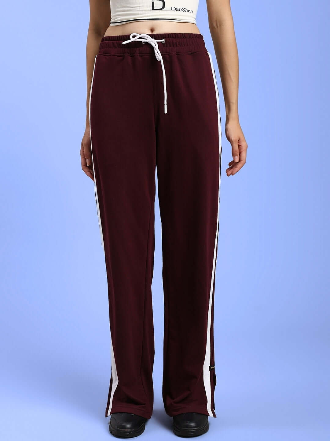 Women's maroon joggers with relaxed fit and adjustable drawstring, ideal for comfort and style. Made by DUDS with custom fit option.