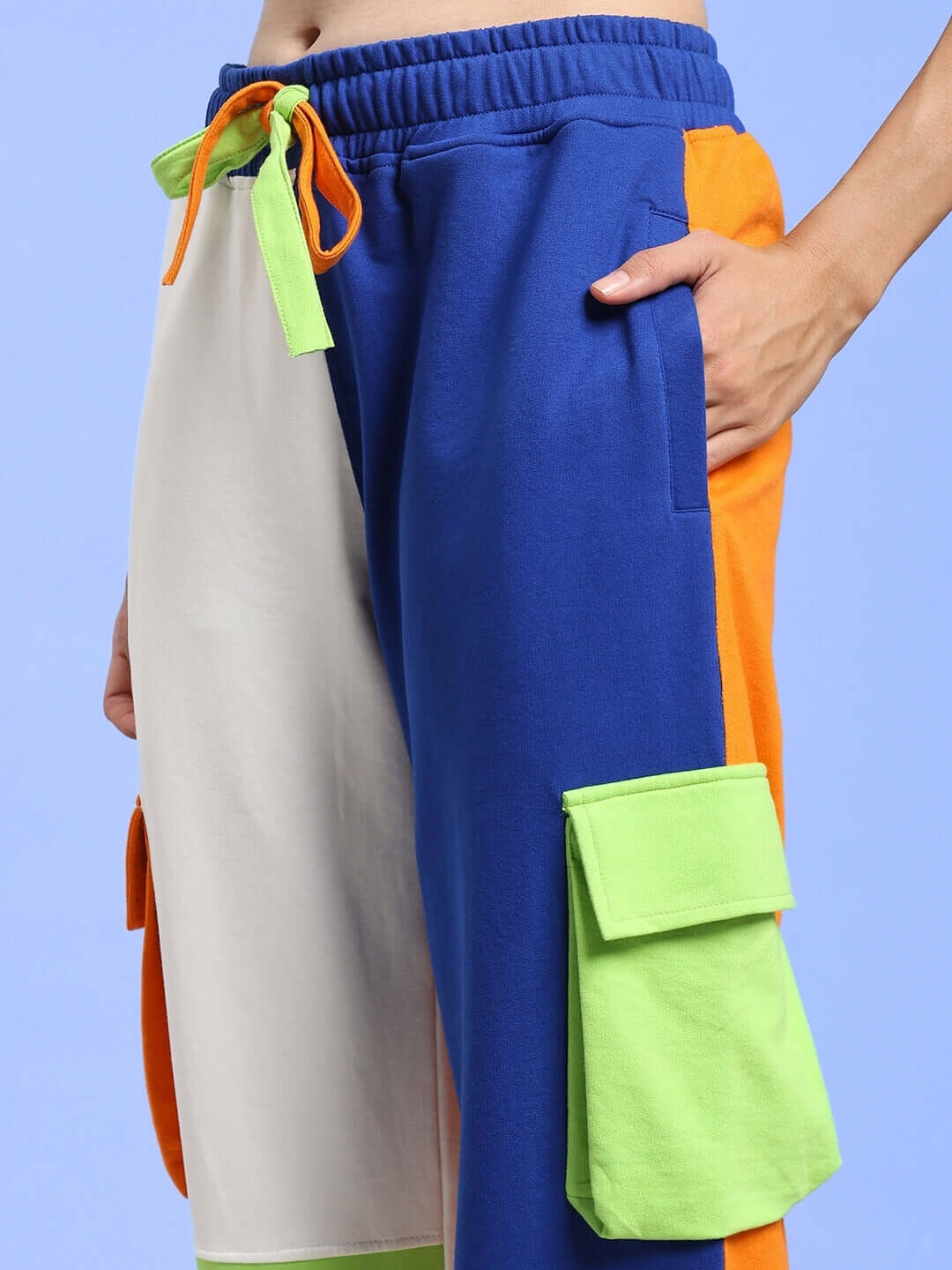 Women’s multi-pocket colorblock joggers in blue, white, orange, and green, featuring a relaxed fit design. Ideal for custom sizing.