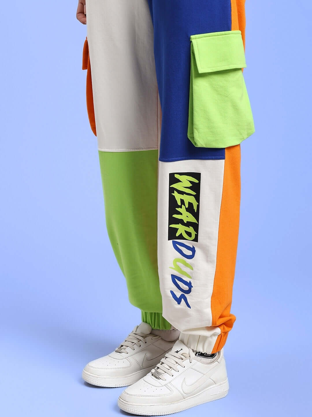 Women's colorblock joggers with multi pockets and relaxed fit, showcasing vivid colors and 'Wear DUDS' logo on pant leg.