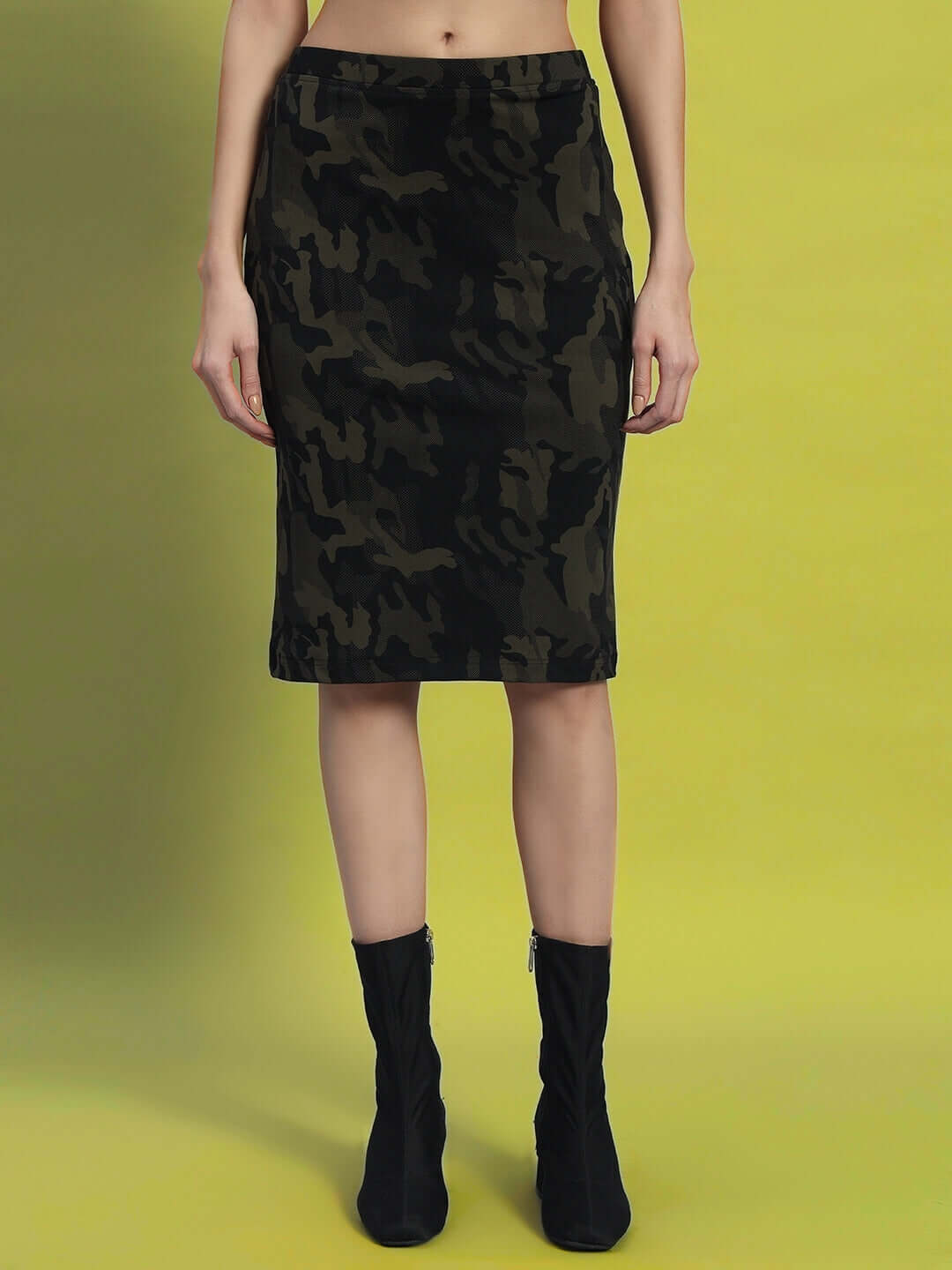 Model wearing WOMEN'S NAIROBI CO-ORD SET CAMO GREEN skirt showcasing bold streetwear fashion by WEAR DUDS.