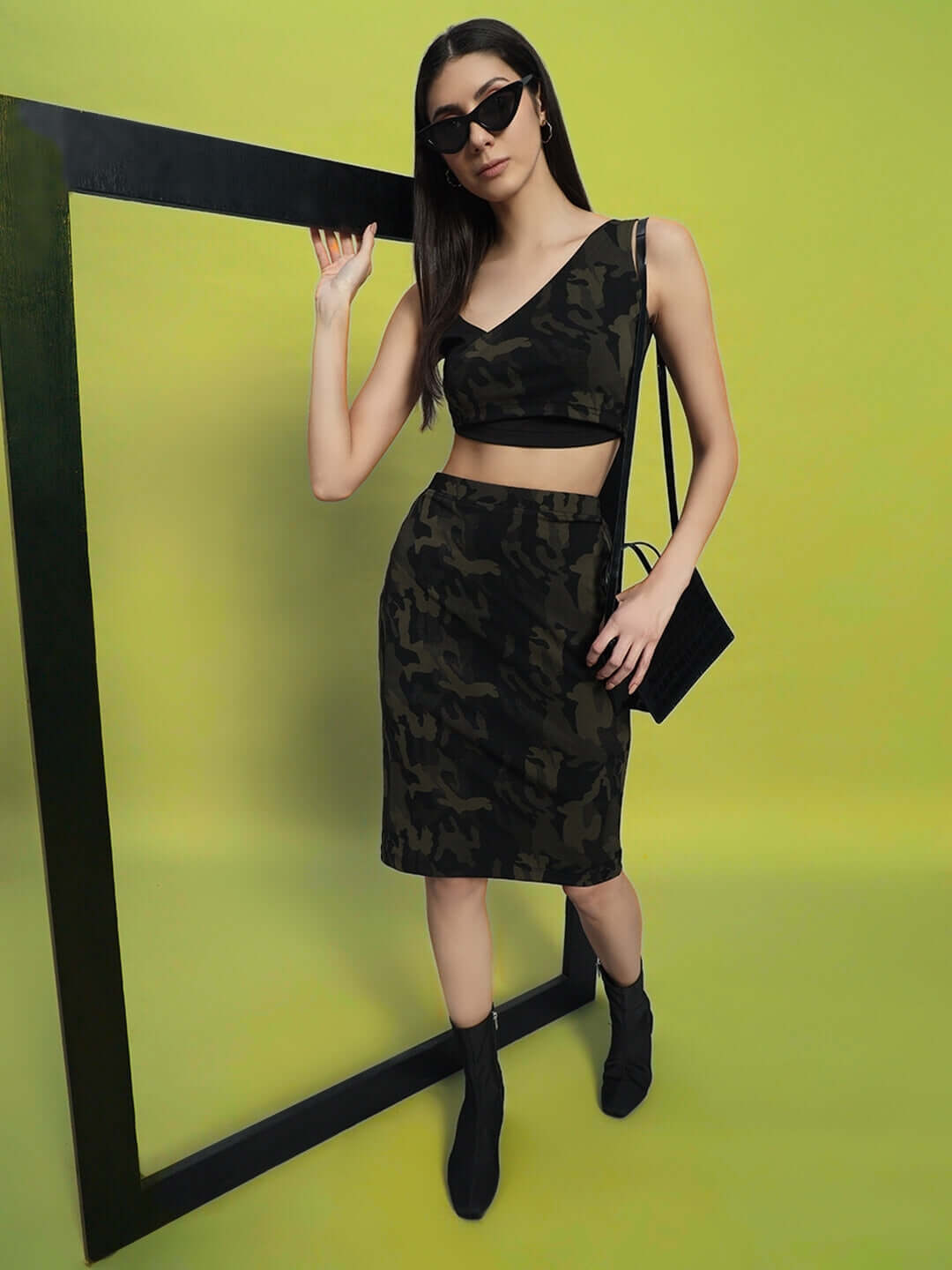 Model wearing WOMEN'S NAIROBI CO-ORD SET CAMO GREEN by WEAR DUDS, a stylish cotton-blend streetwear outfit for women in camo design.