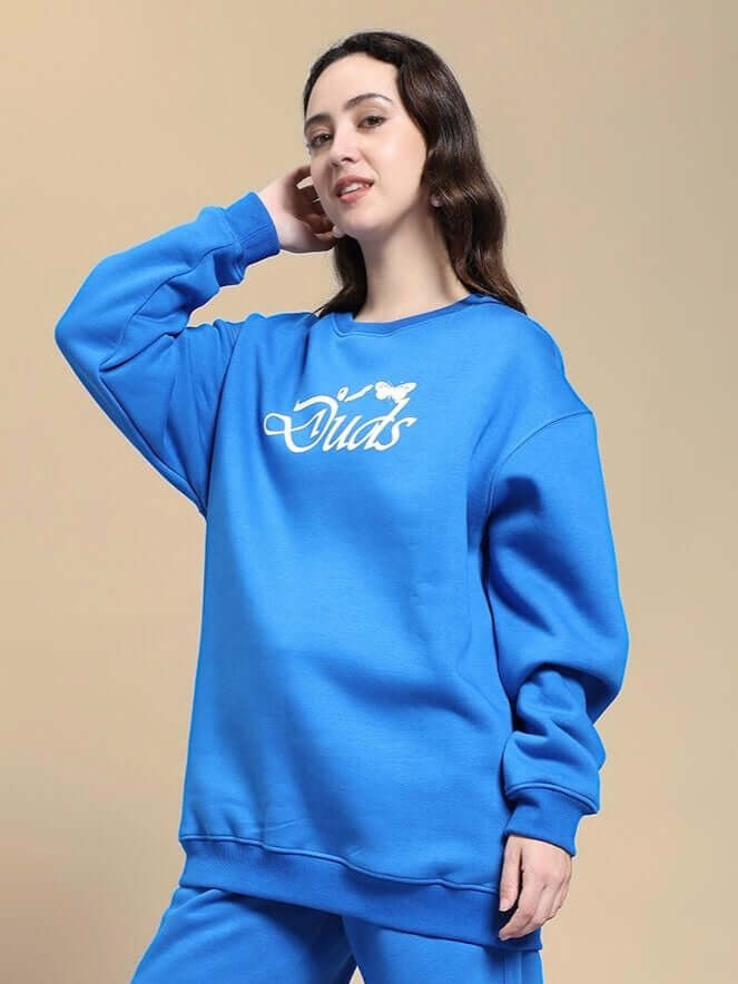 Woman wearing WOMEN NATURE LINK FLEECE SWEATSHIRT ROYAL BLUE, featuring cozy fleece fabric and vibrant royal blue color.