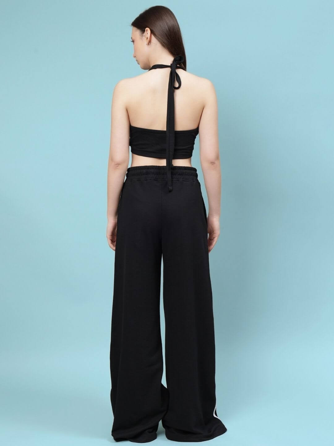 Back view of WOMEN'S NEER CO-ORD SET - BLACK, showcasing elegant design and breathable fabric, perfect for versatile modern fashion.