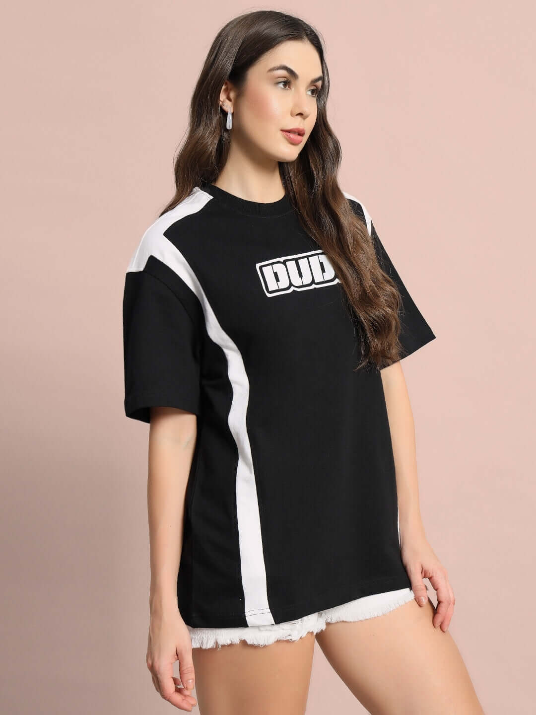 Woman wearing black oversized t-shirt with white stripes, featuring 'DUDE' text, made of premium cotton, black color.