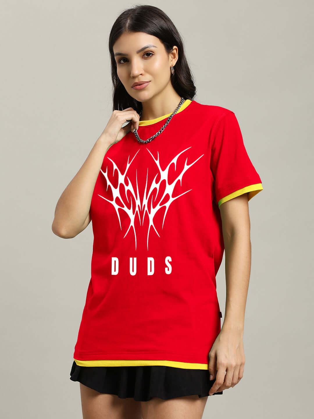 Stylish woman wearing a red women's Noriba regular fit T-shirt with graphic design.