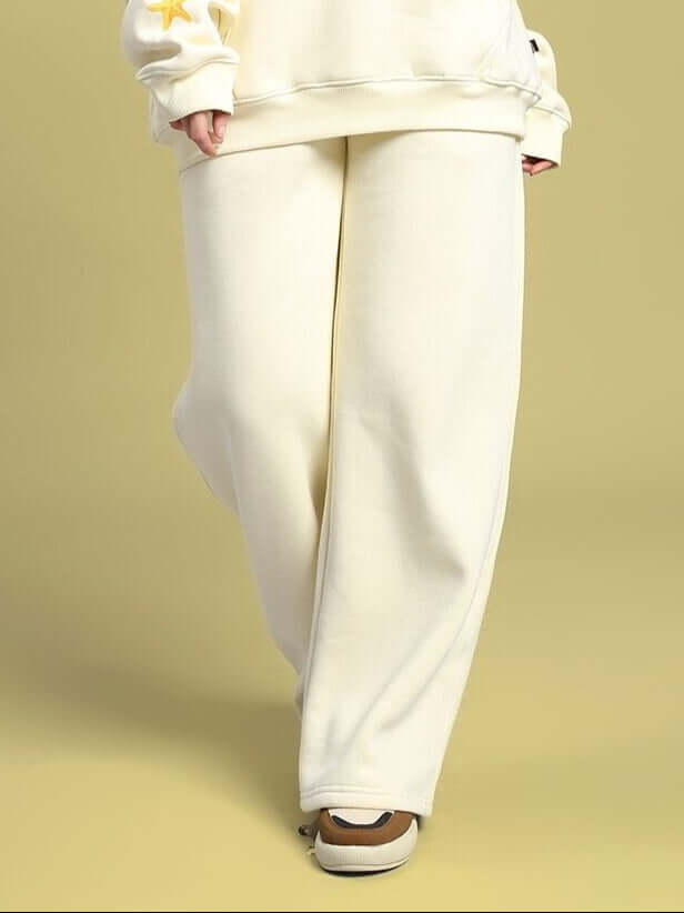 Woman wearing WOMEN'S OCEAN BUDDIES JOGGER OFF-WHITE, showcasing comfort and style with ocean-inspired details.