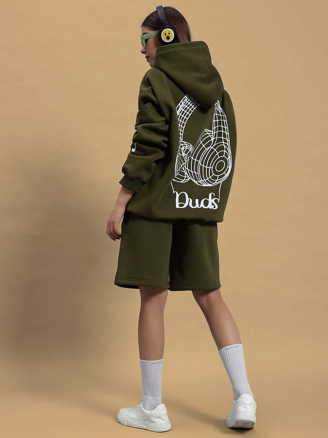 Woman wearing WOMEN OPERA FLEECE CO-ORD OLIVE GREEN with hoodie and shorts, made by DUDS