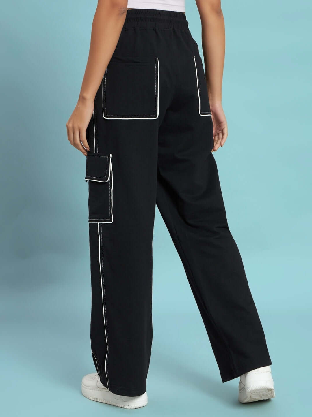 Women's black pedal contrast stitch cargo pants with back pockets, worn by model, showcasing stylish casual design by DUDS.