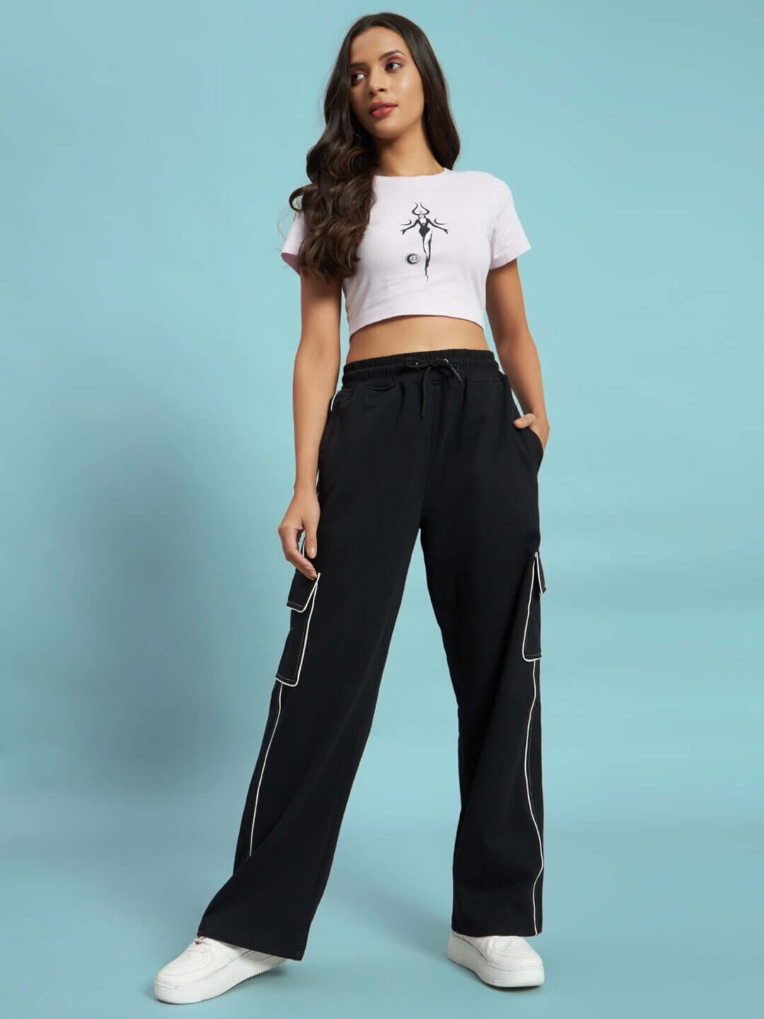 Model wearing Women's Pedal Contrast Stitch Cargo Pant in black by DUDS with custom fit option available.