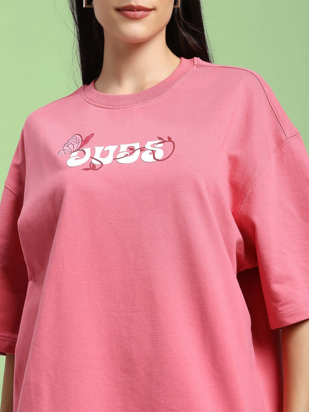 Pink women's printed t-shirt made from premium cotton French terry, featuring a butterfly design and comfortable fit.