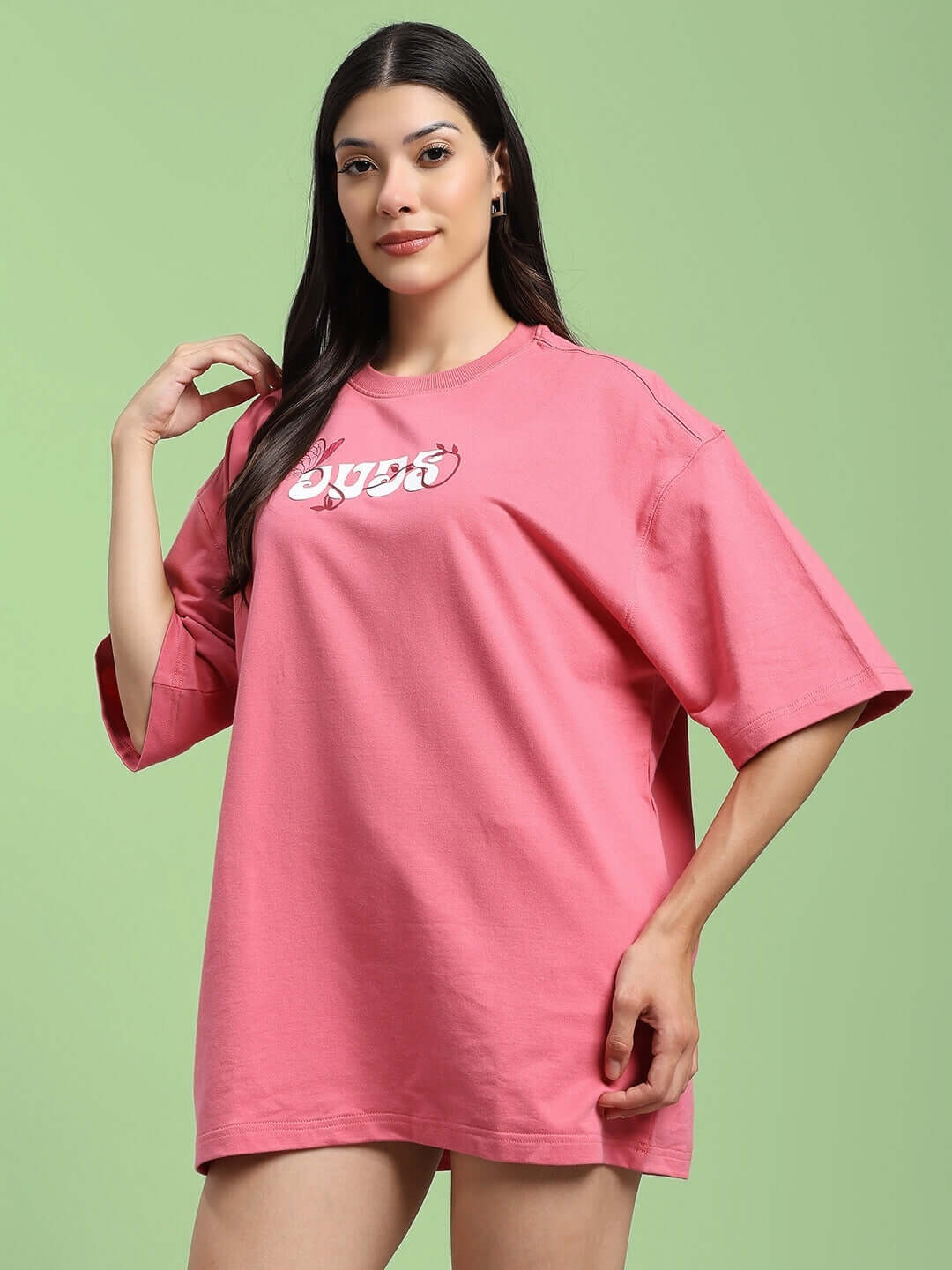 Model wearing Women's Your Feeling Printed T-Shirt in pink, made from premium cotton French terry, featuring a casual fit.