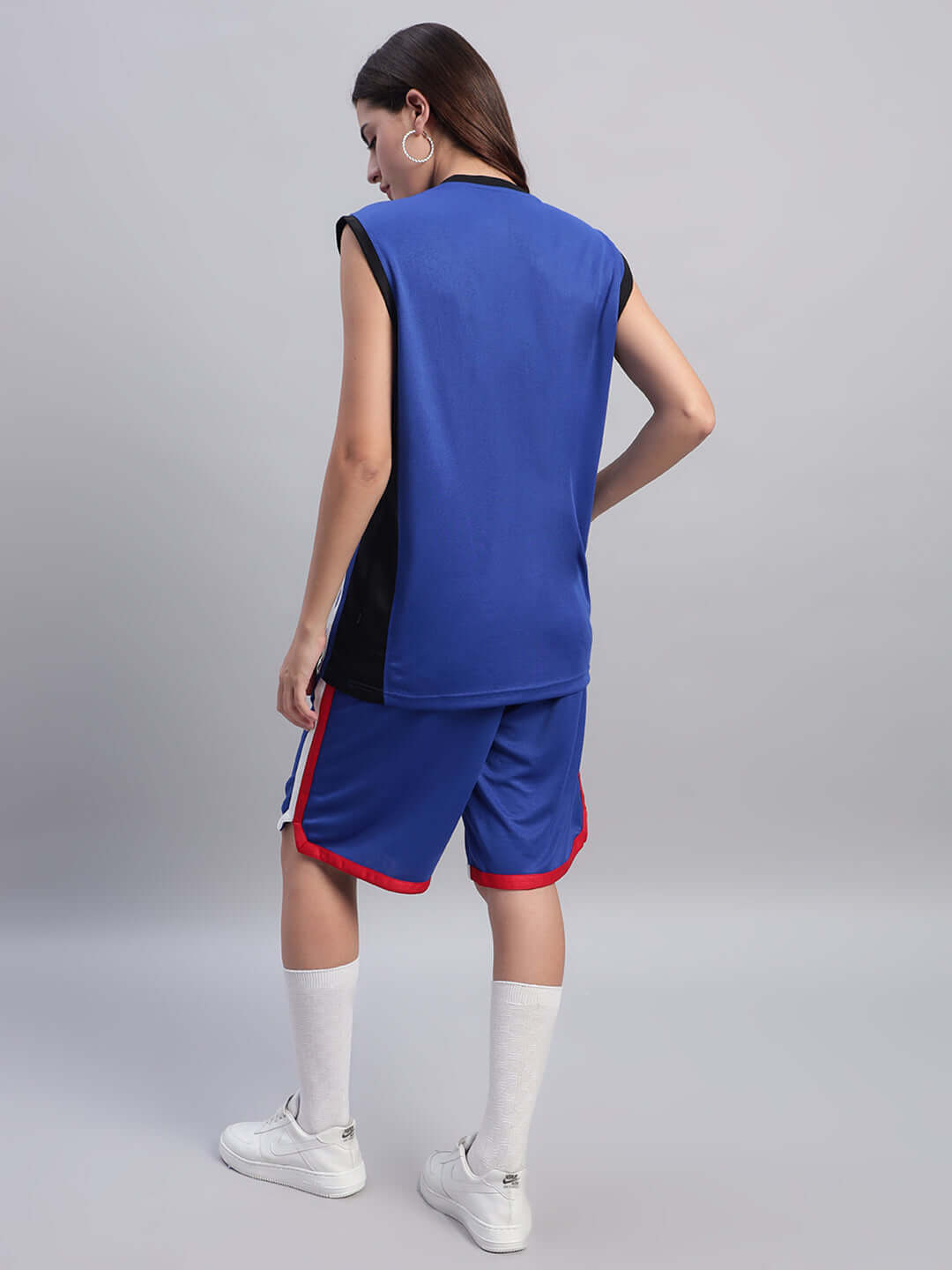 Back view of model wearing WOMEN'S PORTIA GYM CO-ORD SET ROYAL BLUE showcasing sporty style and premium fabric.