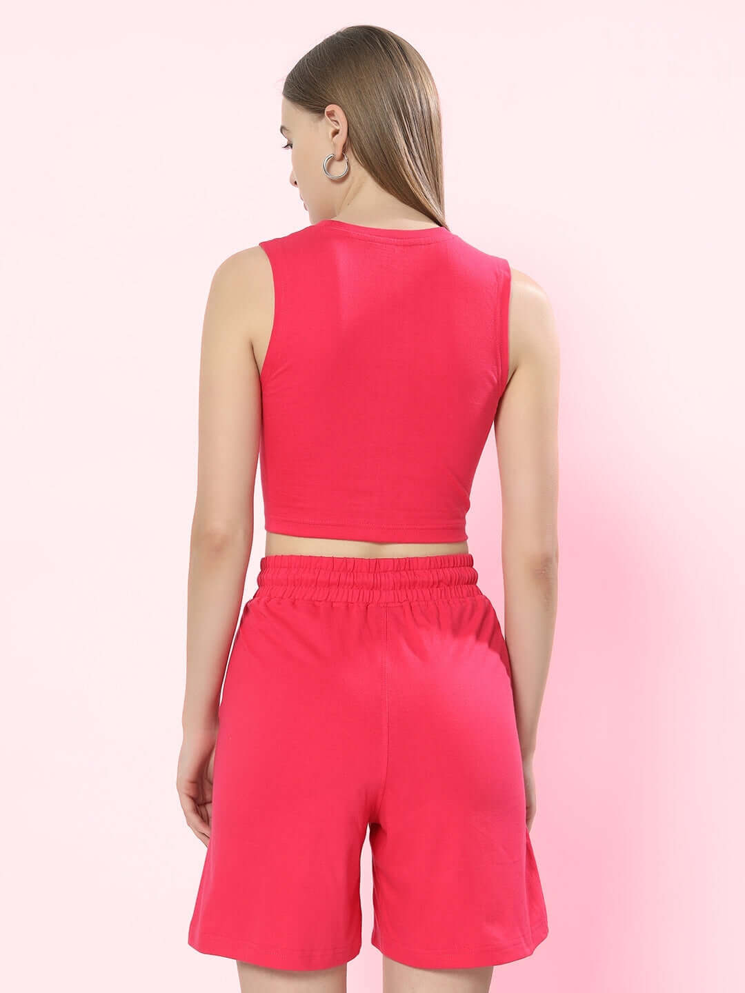 Back view of a model wearing a pink women's positive rabbit co-ord set with shorts, crafted with premium cotton and elastane for comfort.