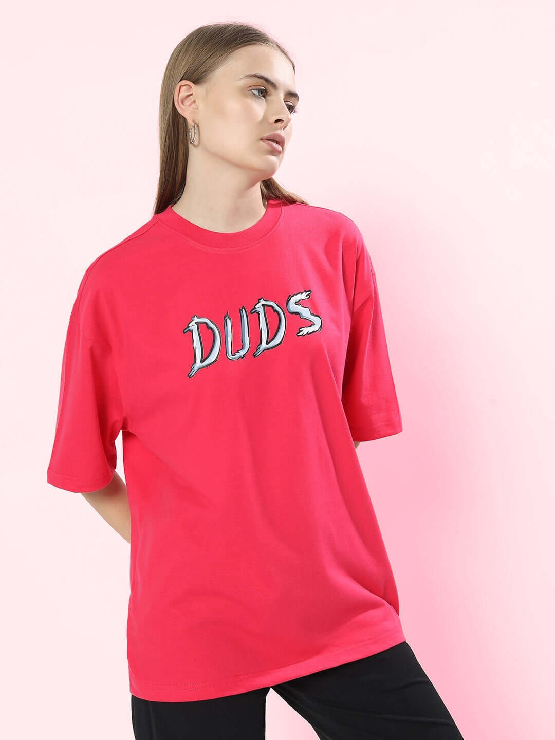 Model wearing Women Positive Rabbit Over-Sized T-Shirt Pink with "Duds" graphic print.