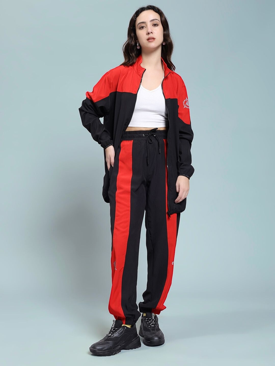 Woman wearing WOMEN POWER BLOCK CO-ORD SET BLACK RED, sporty and stylish outfit for versatile fashion statements.