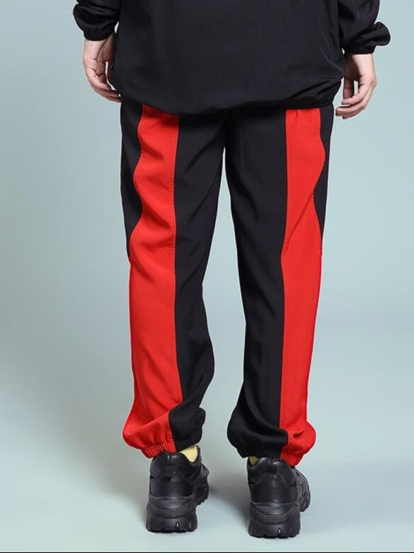 Back view of WOMEN'S POWER BLOCK RELAXED FIT JOGGER BLACK RED showing red stripe detail.