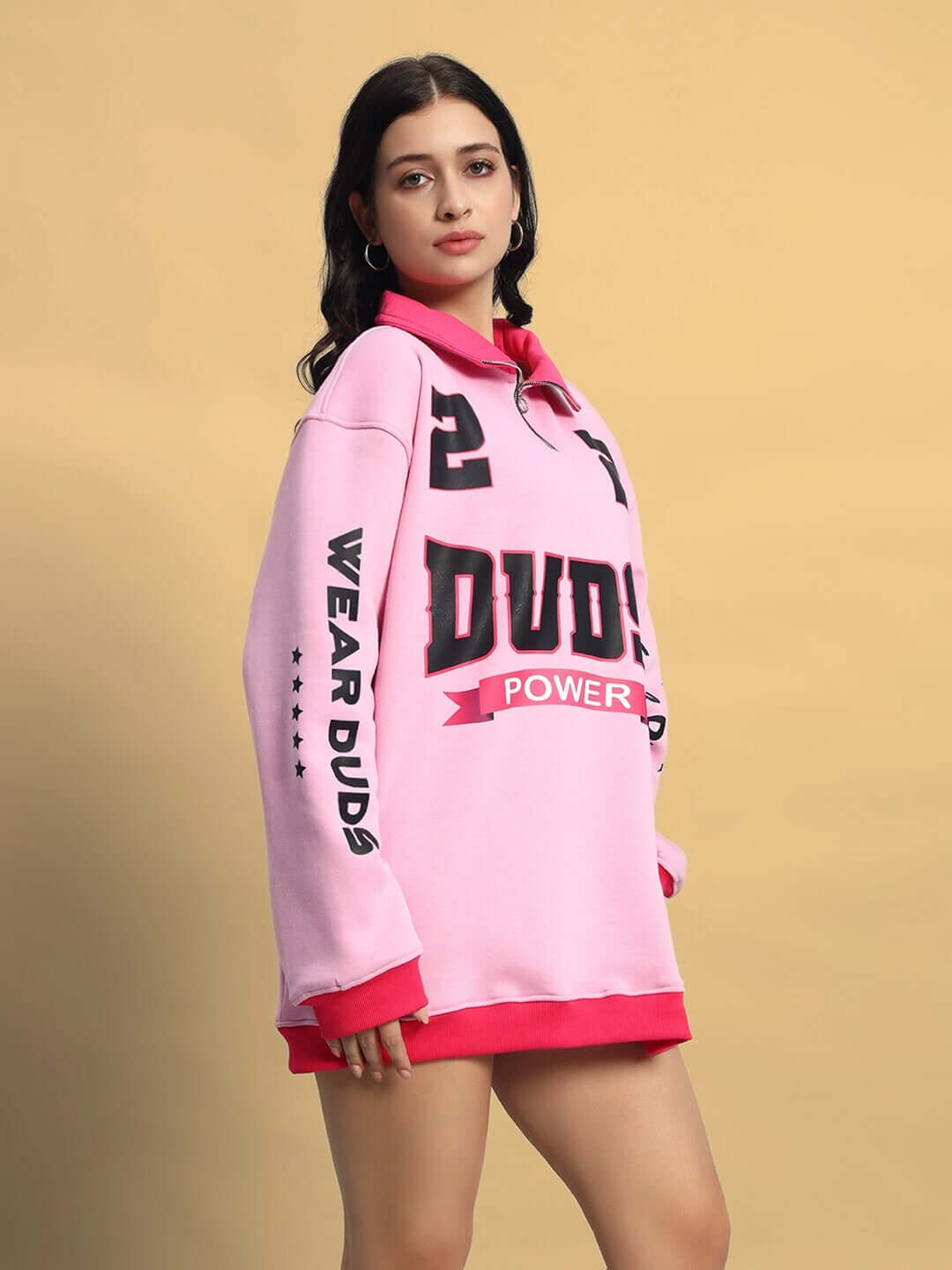 Model wearing WOMEN'S POWER22 SWEATSHIRT DRESS PINK with sporty design and vibrant color.