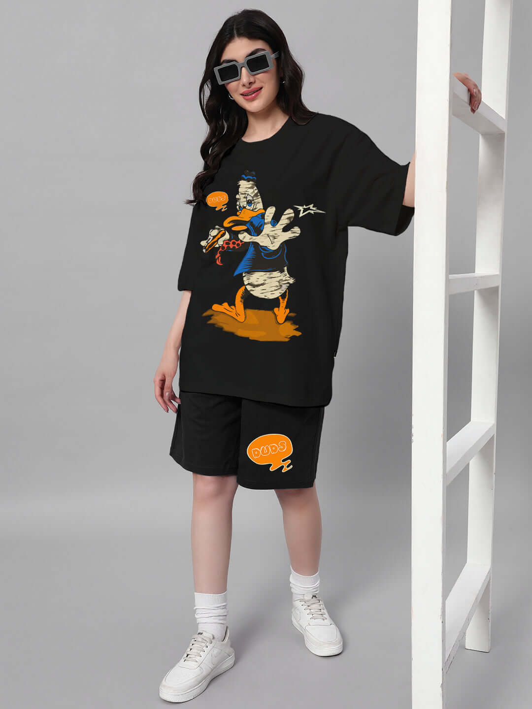 Woman wearing black Quack Off Co-ord set with graphic print, made from premium cotton French terry lycra blend.