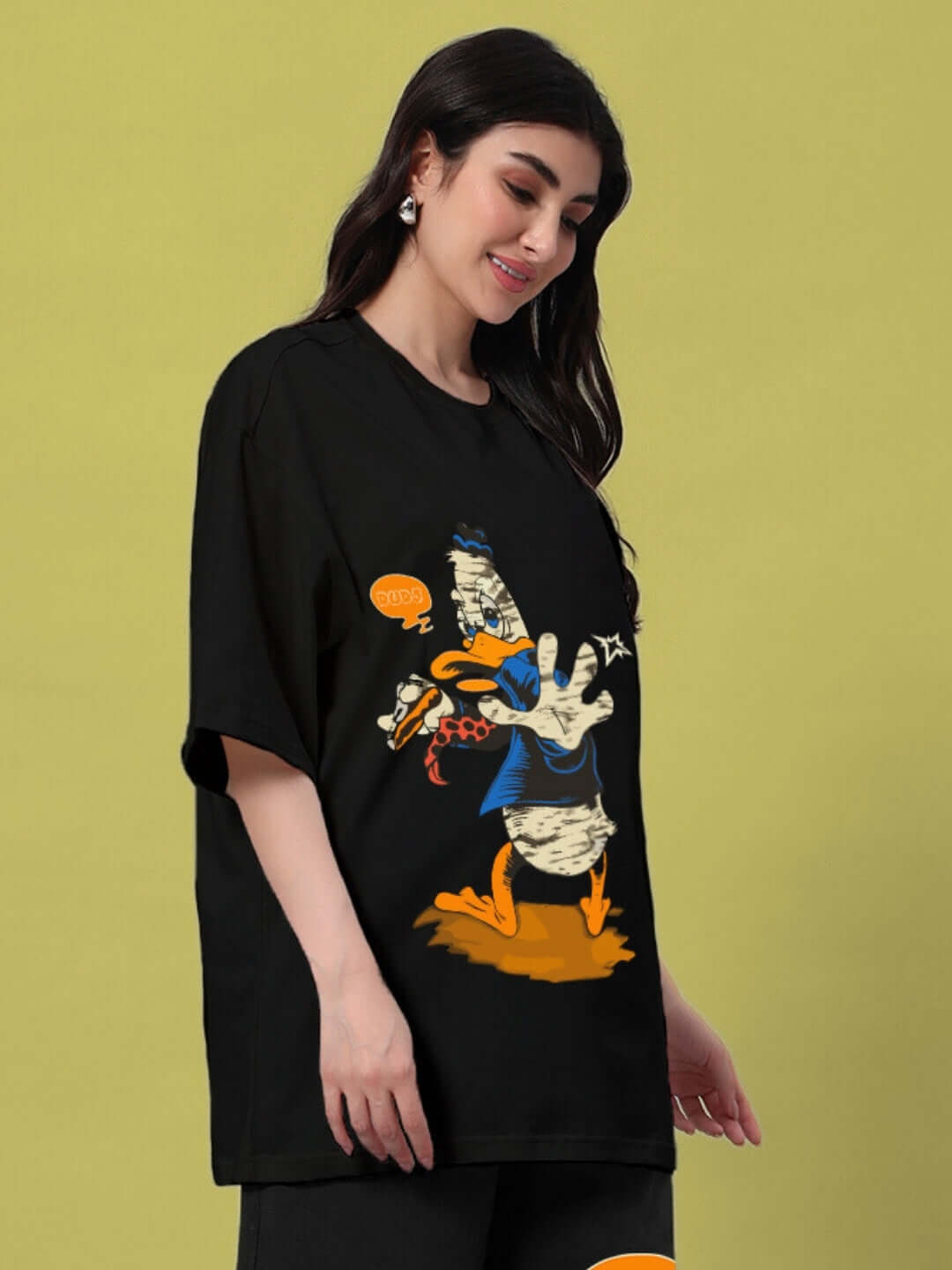 Woman wearing black oversized t-shirt with duck graphic, showcasing casual summer style.