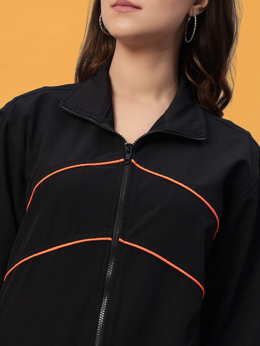 Women's black Raider co-ord set with orange accents, made from polyester. Ideal for stylish, comfortable wear. Machine wash cold.