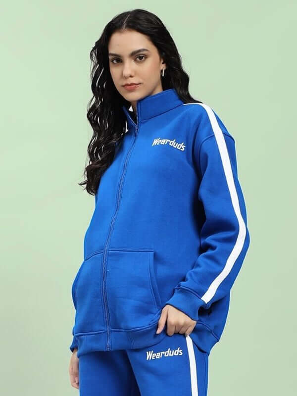 Woman wearing WOMEN RAPID STRIDE COTTON FLEECE JACKET ROYAL BLUE with sporty chic design and vibrant color.