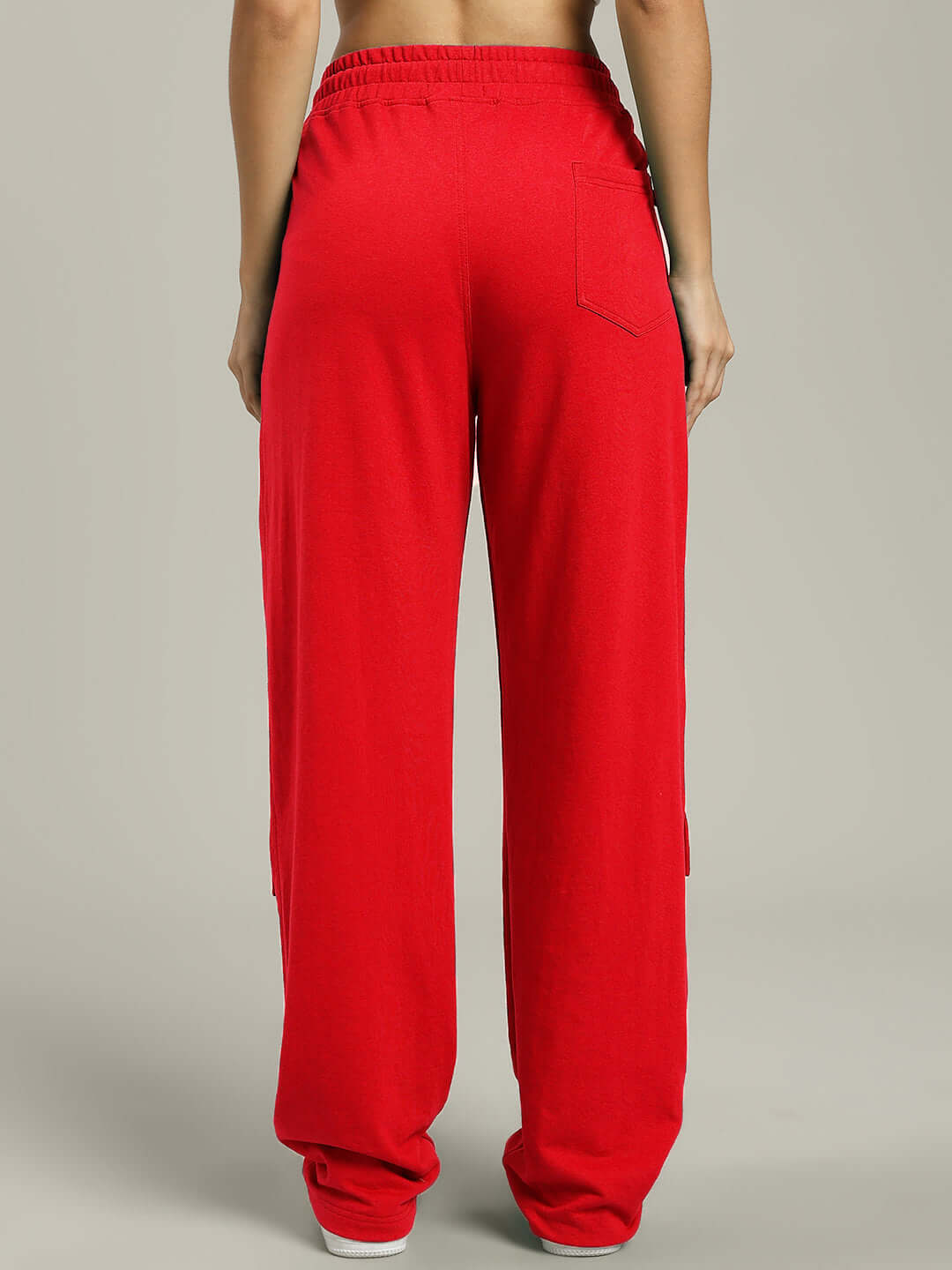 Back view of WOMENS AWESOME FLAP POCKET BAGGY JOGGER RED showcasing relaxed fit and flap pocket design.
