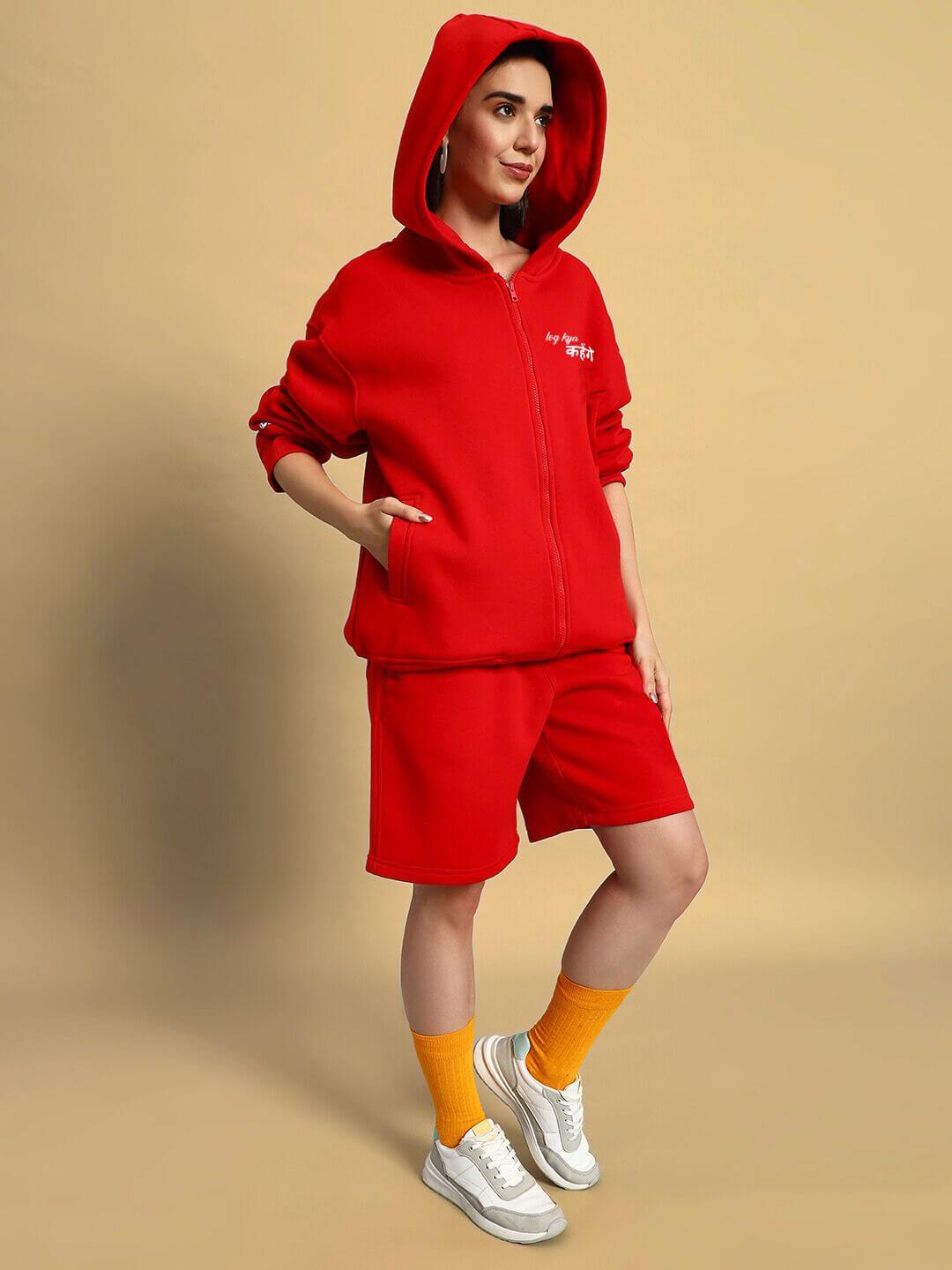 Woman wearing WOMENS A LOOK ATTITUDE FLEECE CO-ORD RED set with hoodie and shorts, capturing bold street-style fashion and plush comfort.
