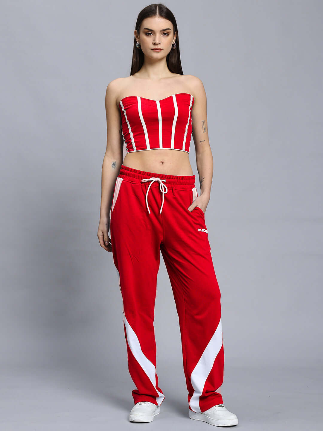 Model wearing WOMEN'S LIVIANA COOL CO-ORD SET RED, showcasing bold and street-chic fashion from WEAR DUDS, designed with comfort in mind.