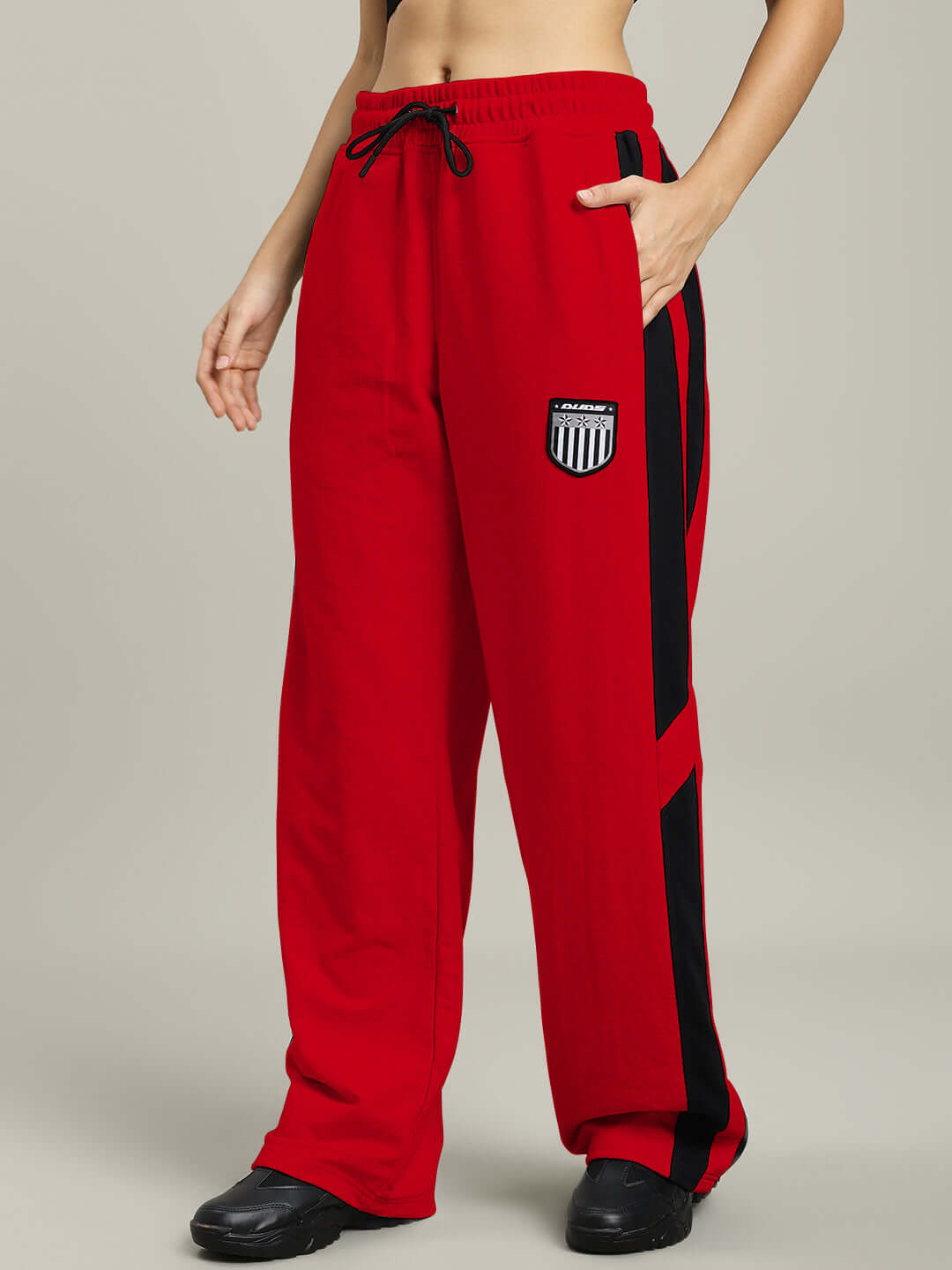 Red WOMEN'S ROYALSON joggers by DUDS with black stripe accents, featuring a comfortable fit, made-to-order for custom sizing.
