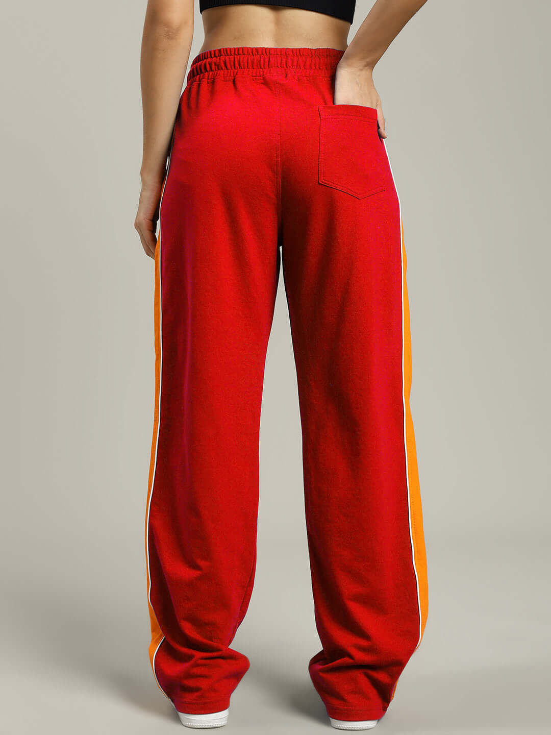 Back view of Women's Sanford Stripe Joggers in red with orange side stripes, featuring an elastic waistband and comfortable fit.