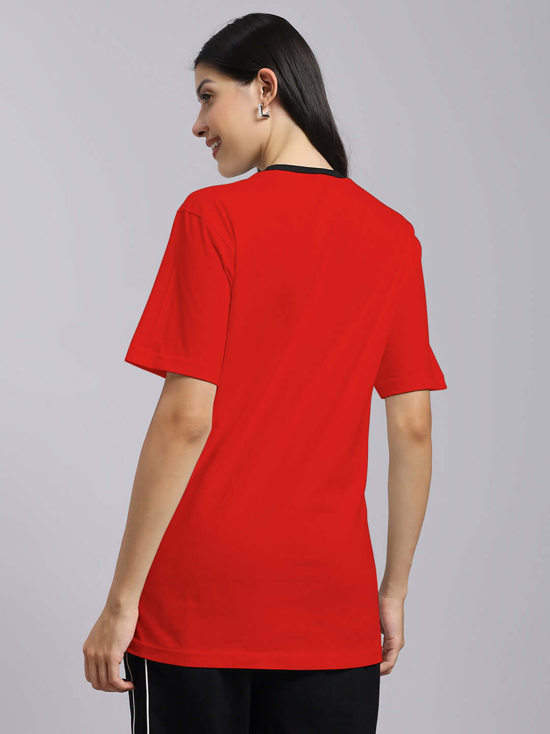 Back view of a model wearing Womens Trust No One Regular Fit Printed T-Shirt Red, highlighting its vibrant color and relaxed fit.