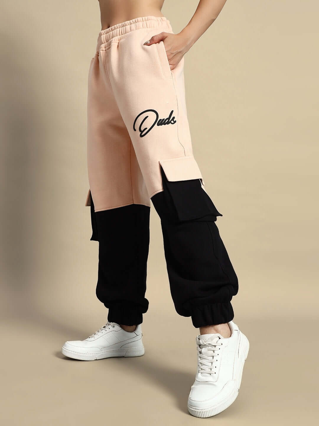 Beige and black WOMEN REGIMENT FLEECE CO-ORD SET showcasing stylish design with white sneakers.