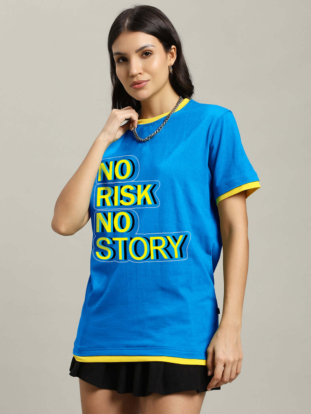 Woman wearing a blue regular fit t-shirt with 'No Risk No Story' text, made of 100% cotton. Ideal casual wear for women. Made in India.