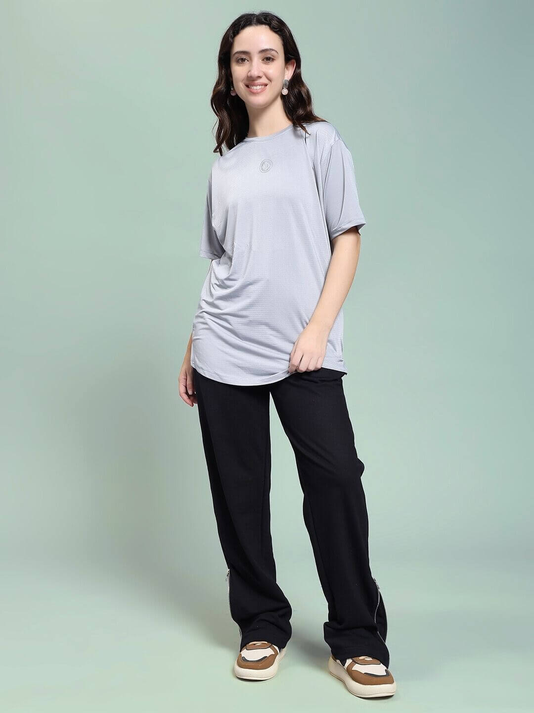 Woman wearing WOMEN JOSS WINS RELAXED-FIT JOGGER BLACK for effortless comfort and modern style, standing confidently against a soft background.