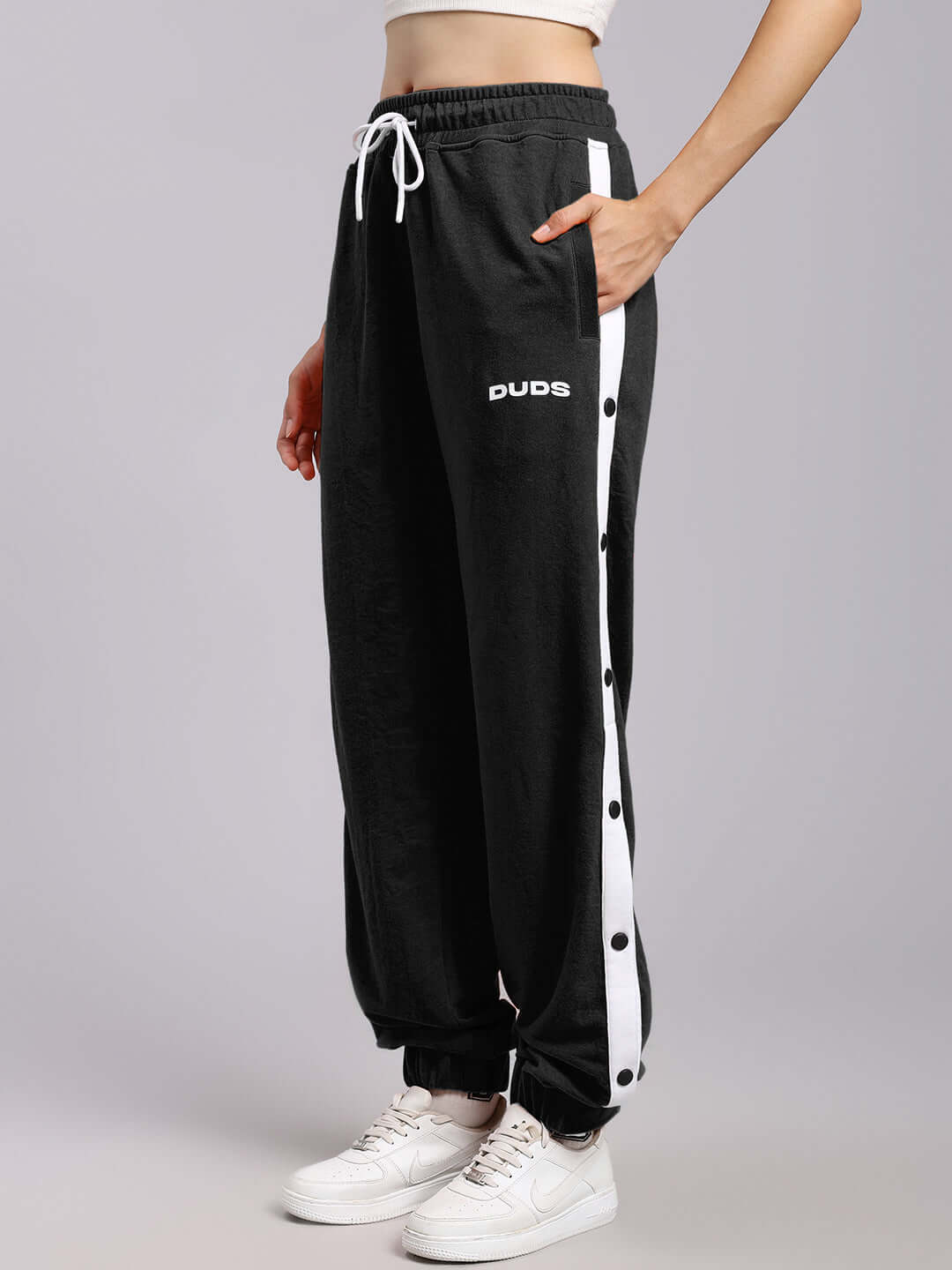 WOMENS MILLER RELAXED FIT JOGGERS BLACK showcased with side buttons and drawstring, perfect for casual wear and style.