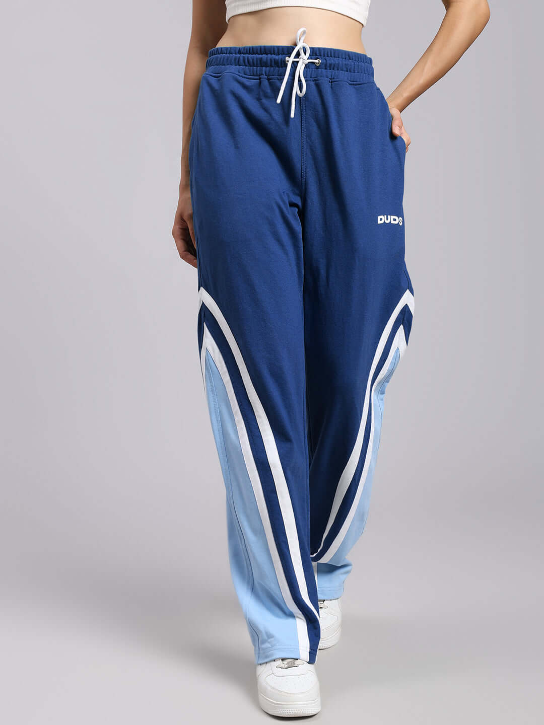 Woman wearing WOMENS RIO ONE RELAXED FIT JOGGERS BLUE, featuring a relaxed fit and stylish design for comfort and easy movement.