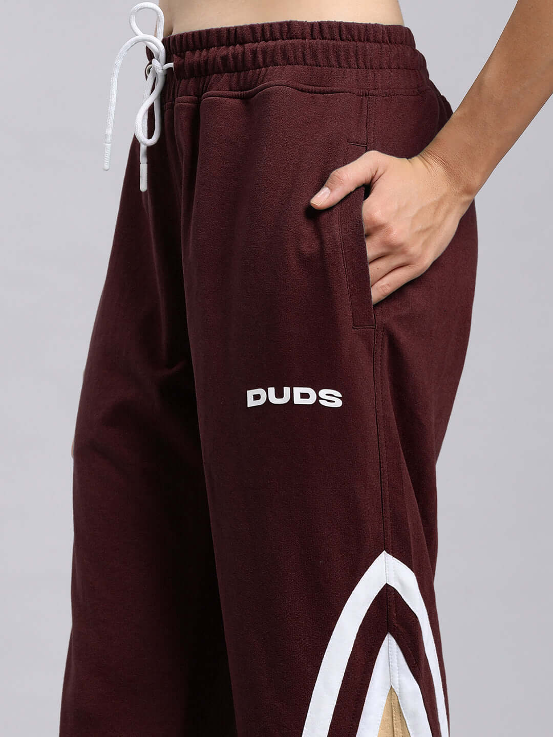 Alt Tag: Women's Rio One Relaxed Fit Joggers in Maroon with embroidered DUDS logo, showcasing pocket detail and drawstring, custom fit options available.