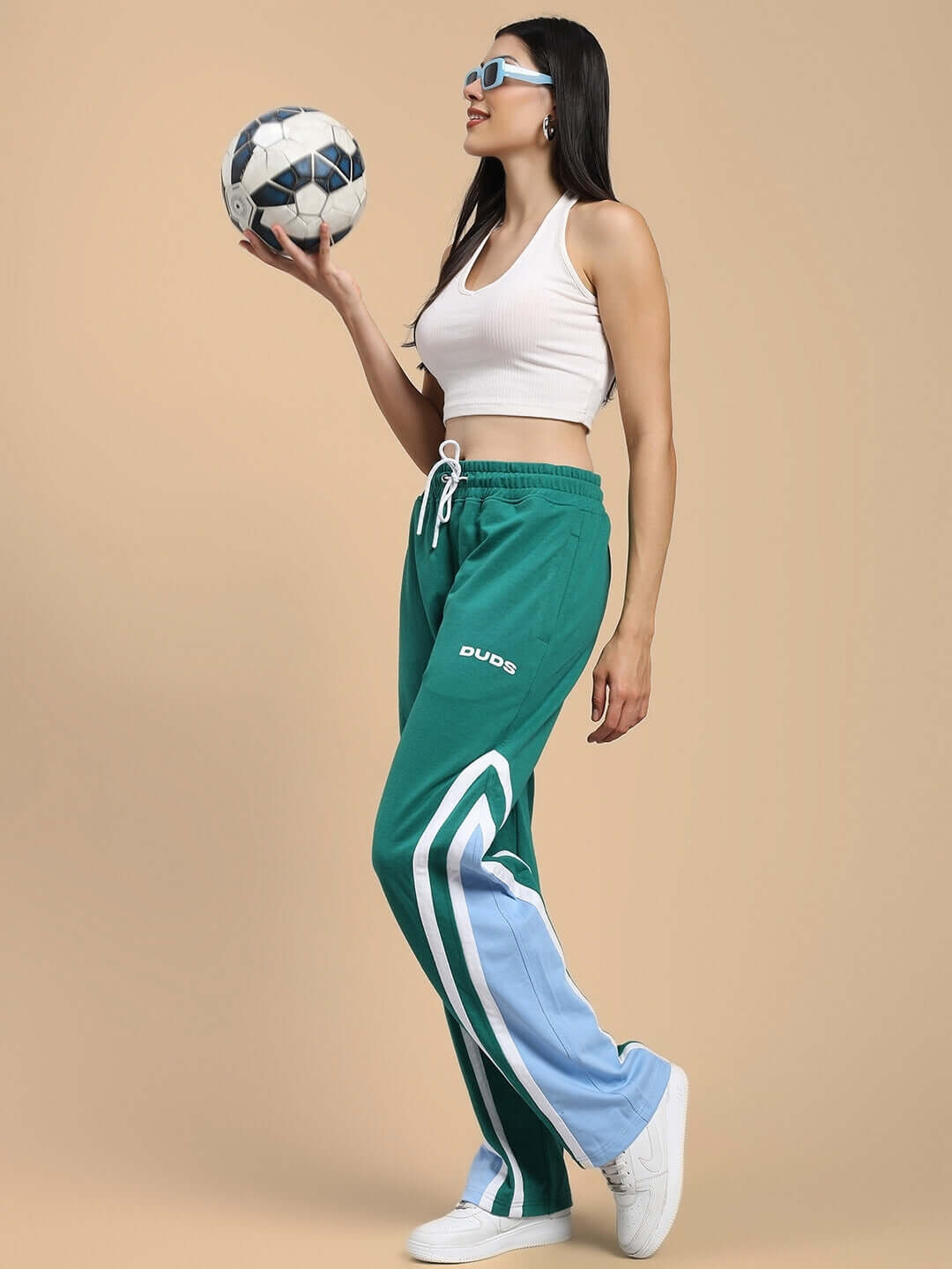 Woman modeling WOMENS RIO ONE RELAXED FIT JOGGERS TEAL GREEN with soccer ball