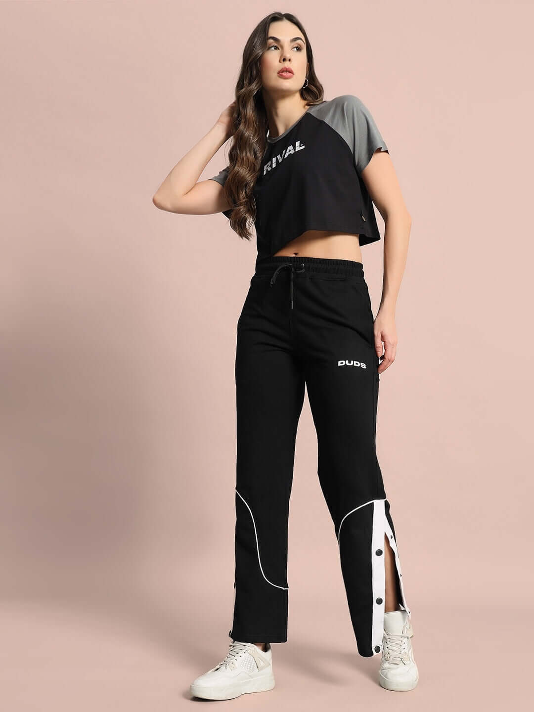 Women's Rival Raglan Crop-Top in Black Grey, made from 100% premium cotton, displayed on model with casual black pants.