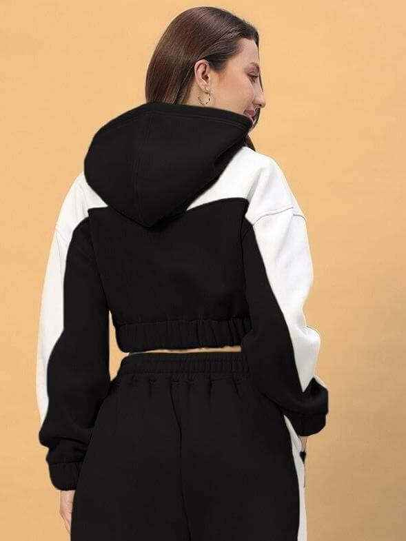 Back view of model wearing WOMEN RIZZLER OVERSIZED CROP HOODIES BLACK showcasing trendy oversized and cropped fit.