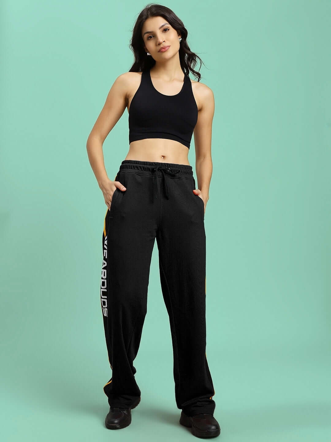 Model wearing WOMENS ROGER RELAXED-FIT JOGGERS BLACK, showcasing the comfort and style of premium fabric joggers.