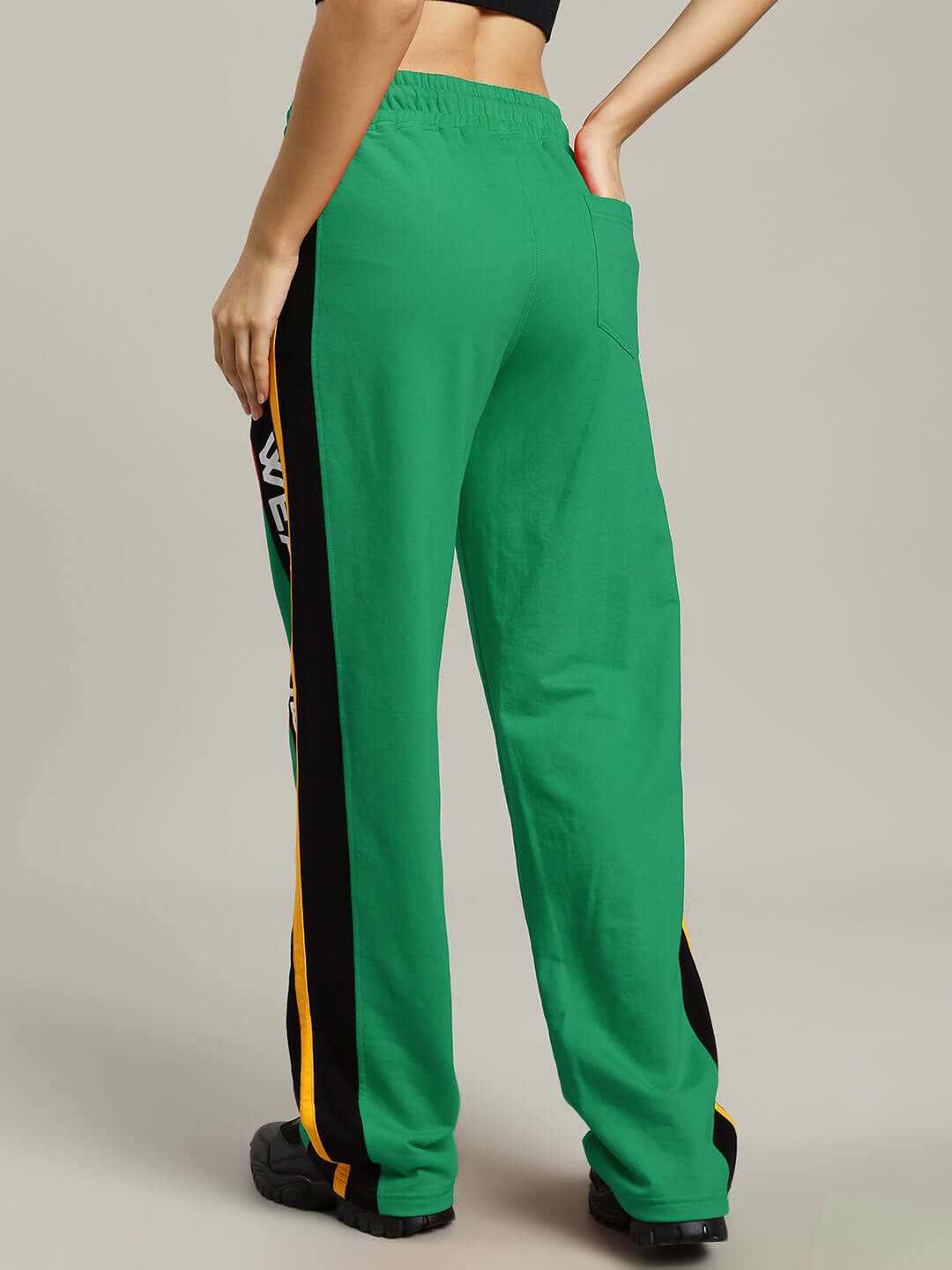 Back view of WOMENS ROGER RELAXED-FIT JOGGERS GREEN with elastic waistband and vibrant color.
