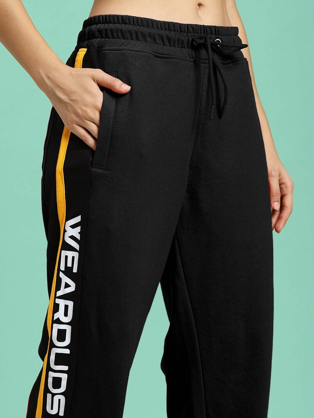 WOMENS ROGER RELAXED-FIT JOGGERS BLACK showcasing side stripe and pocket design.