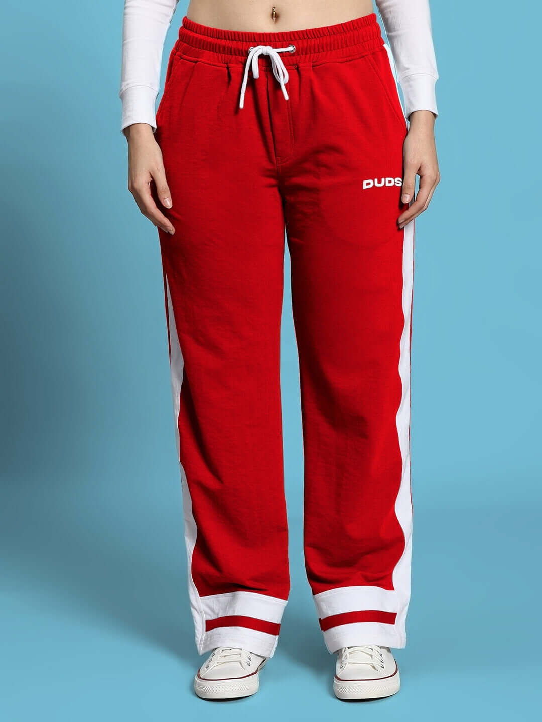 Women's red joggers with white side stripes from DUDS, featuring a drawstring waist and comfortable fit.