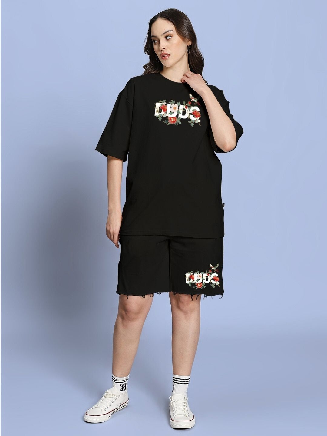 Woman wearing WOMEN ROSE CHARM RELAXED FIT CO-ORD SET BLACK showcasing chic and comfortable fashion for casual outings.