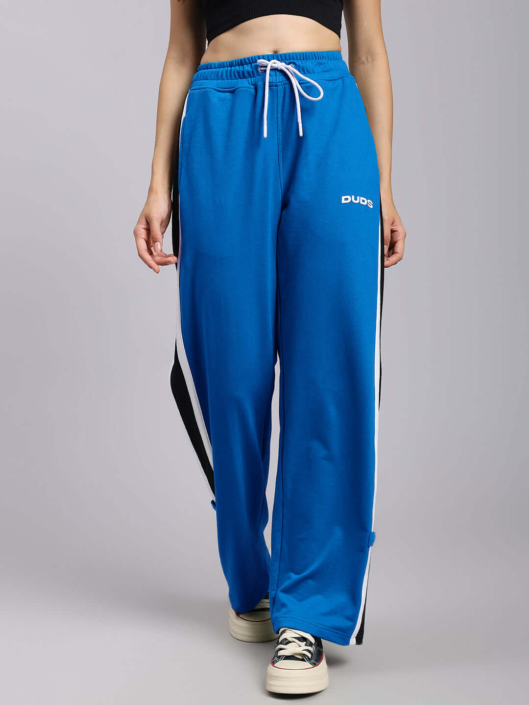 Women's blue Rosston joggers with relaxed fit and white drawstring, made by DUDS, highlighting comfort and style.