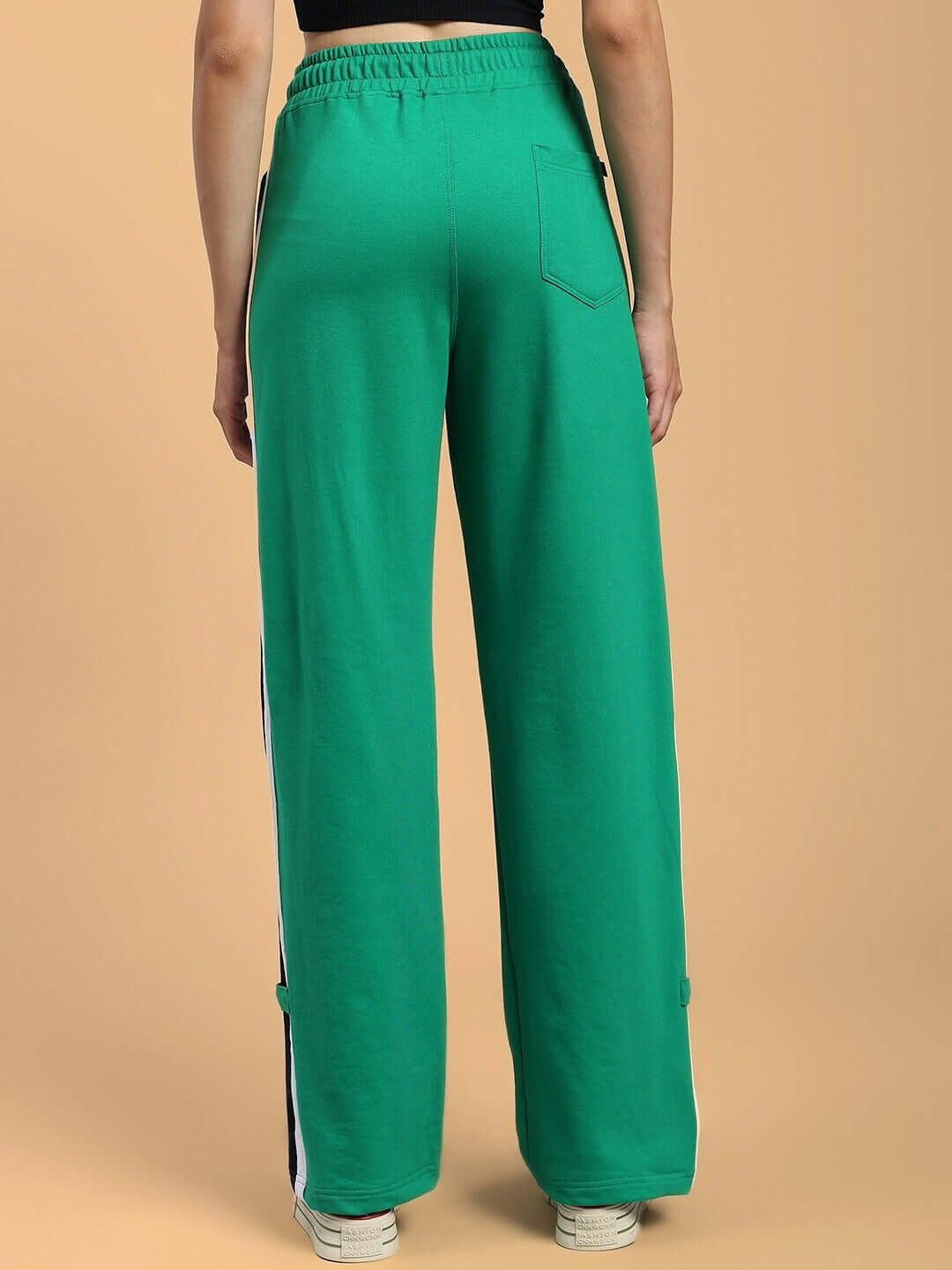Back view of Women's Rosston Flat-Out Relaxed Fit Joggers in green, showcasing elastic waistband and comfortable design by DUDS.